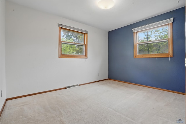 628 Oakland, Rapid City, SD 57701 - carpeted spare room with healthy amount of natural light and baseboards