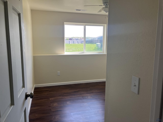 6323 Felicia St, Rapid City, SD 57703 - spare room featuring wood finished floors, ceiling fan, and baseboards