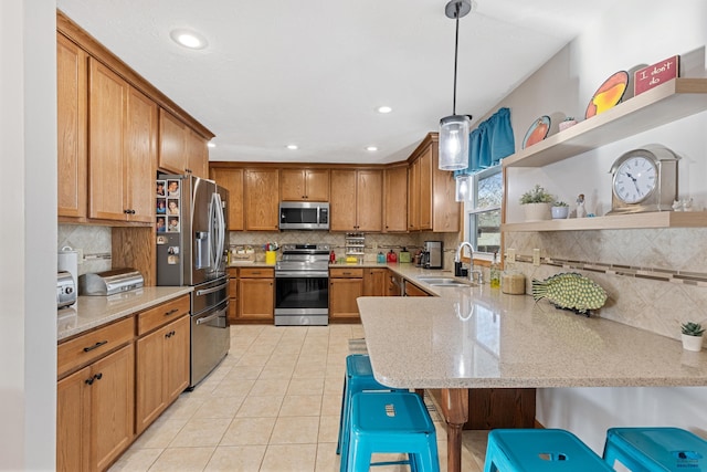 3513 Chapel Valley Rd, Rapid City, SD 57702 - kitchen featuring stainless steel appliances, a sink, backsplash, a peninsula, and recessed lighting