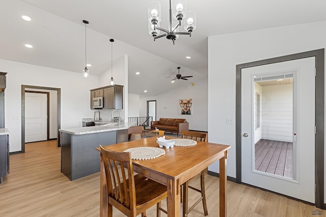 3053 Hoefer Ave, Rapid City, SD 57701 - dining room with light wood-style flooring, lofted ceiling, a ceiling fan, recessed lighting, and a chandelier