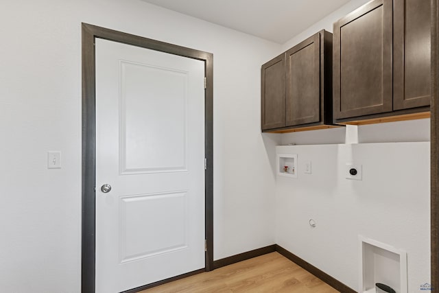 3053 Hoefer Ave, Rapid City, SD 57701 - laundry room featuring cabinet space, washer hookup, light wood-style floors, electric dryer hookup, and baseboards