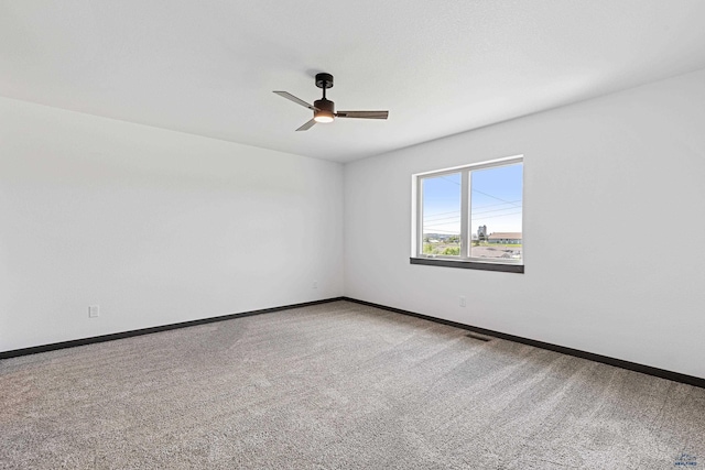 3053 Hoefer Ave, Rapid City, SD 57701 - spare room with carpet flooring, a ceiling fan, and baseboards