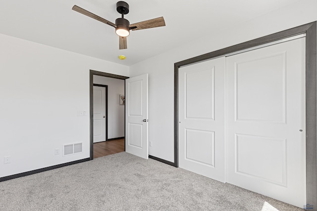 3053 Hoefer Ave, Rapid City, SD 57701 - unfurnished bedroom featuring carpet flooring, baseboards, a closet, and ceiling fan