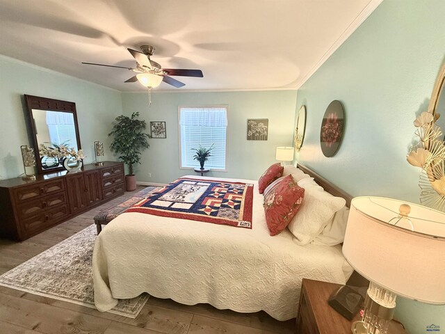 1222 Foothill Dr, Spearfish, SD 57783 - bedroom with crown molding, a ceiling fan, wood finished floors, and baseboards