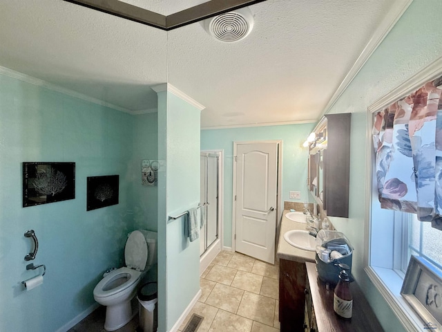 1222 Foothill Dr, Spearfish, SD 57783 - bathroom with double vanity, a stall shower, crown molding, toilet, and tile patterned floors