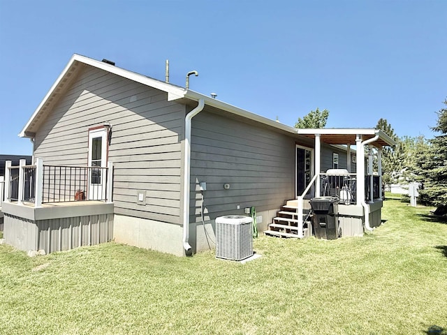 1222 Foothill Dr, Spearfish, SD 57783 - back of property featuring a yard, cooling unit, and a wooden deck