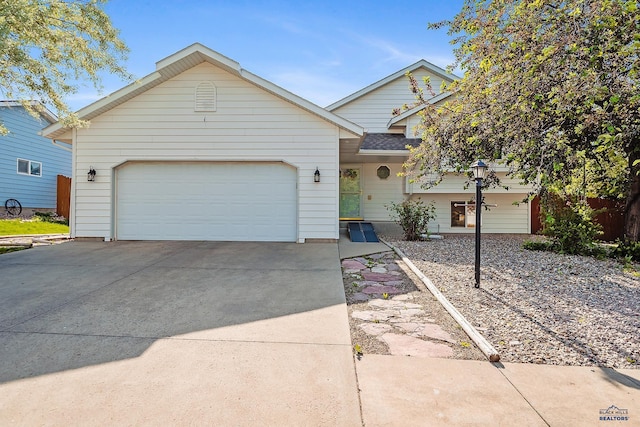 2198 Old Farm Ct, Rapid City, SD 57703 - view of front facade with driveway, a garage, and a shingled roof