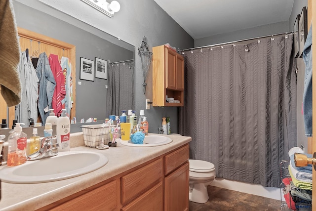 2198 Old Farm Ct, Rapid City, SD 57703 - bathroom with double vanity, toilet, and curtained shower