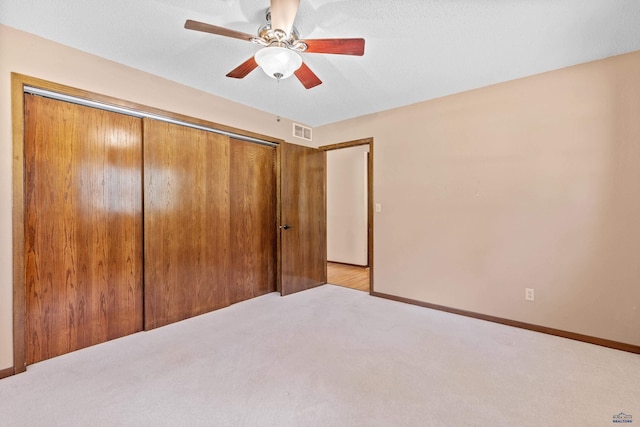 13741 Chipmunk Pl, Rapid City, SD 57702 - unfurnished bedroom with carpet floors, a closet, a ceiling fan, and baseboards