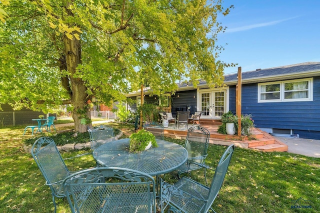3112 Flint Dr, Rapid City, SD 57702 - view of yard with french doors, outdoor dining space, and a wooden deck