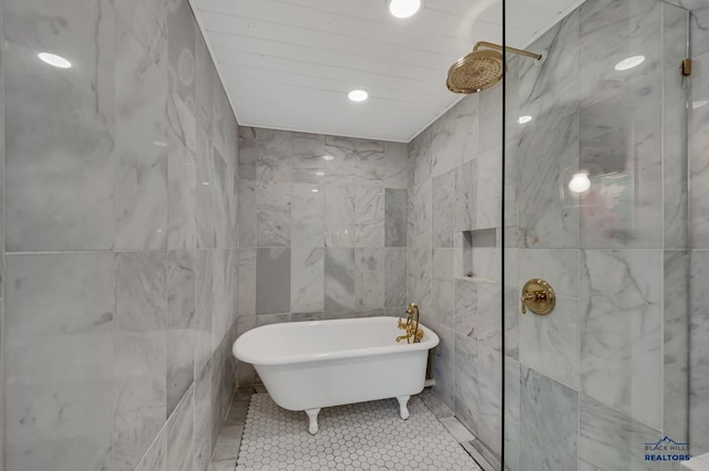 3112 Flint Dr, Rapid City, SD 57702 - bathroom with tile walls, a tile shower, a freestanding tub, and tile patterned floors