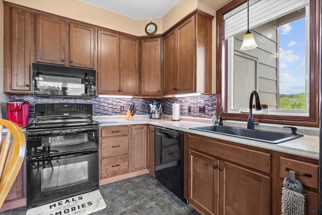 4035 Fairway Hills Dr, Rapid City, SD 57702 - kitchen featuring black appliances, a sink, light countertops, backsplash, and hanging light fixtures