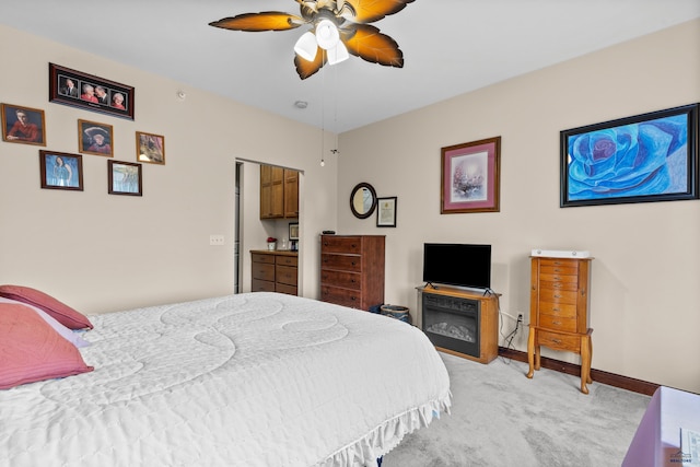 4035 Fairway Hills Dr, Rapid City, SD 57702 - bedroom with light carpet, baseboards, and ceiling fan