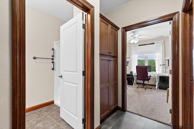 4035 Fairway Hills Dr, Rapid City, SD 57702 - hall featuring a desk and baseboards