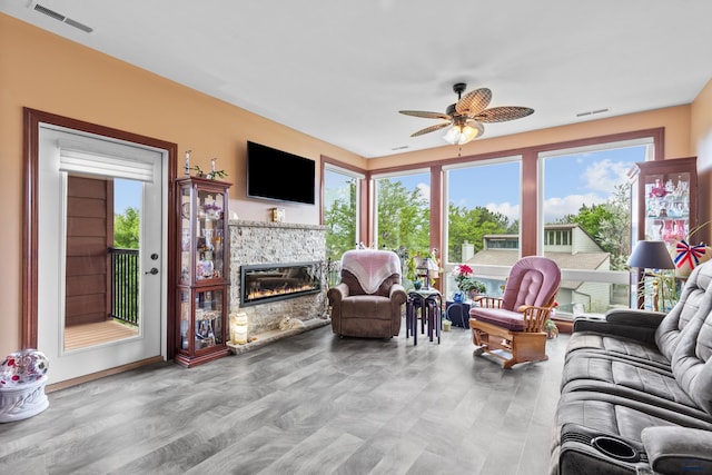 4035 Fairway Hills Dr, Rapid City, SD 57702 - living area with ceiling fan and a fireplace
