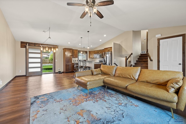 10145 Laramie Ln, Summerset, SD 57718 - living area with dark wood finished floors, vaulted ceiling, ceiling fan, stairs, and recessed lighting
