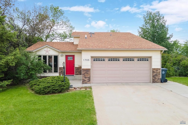 1705 Copperdale Dr, Rapid City, SD 57703 - view of front of property featuring driveway, brick siding, an attached garage, and a front lawn