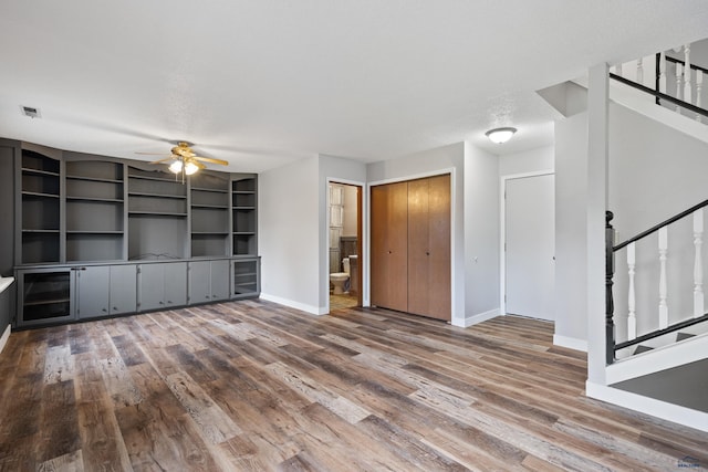 1705 Copperdale Dr, Rapid City, SD 57703 - spare room with stairs, baseboards, a ceiling fan, and wood finished floors