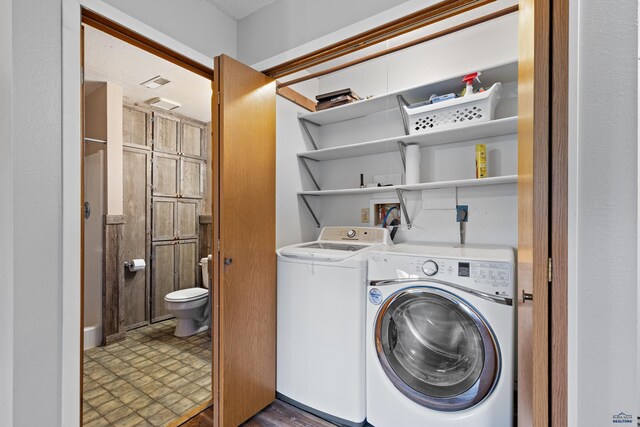 1705 Copperdale Dr, Rapid City, SD 57703 - washroom with washing machine and dryer and dark floors