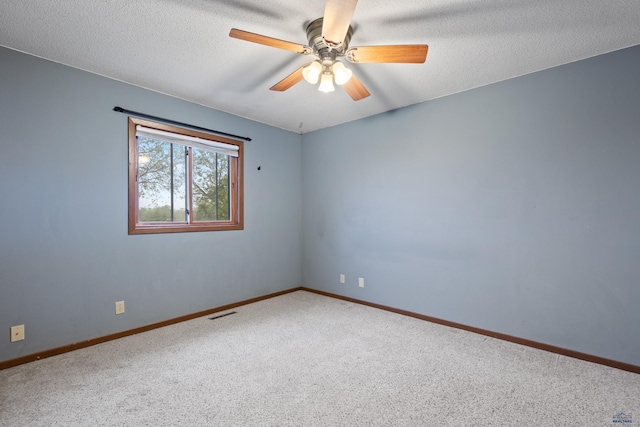 1705 Copperdale Dr, Rapid City, SD 57703 - carpeted spare room with ceiling fan, baseboards, and a textured ceiling