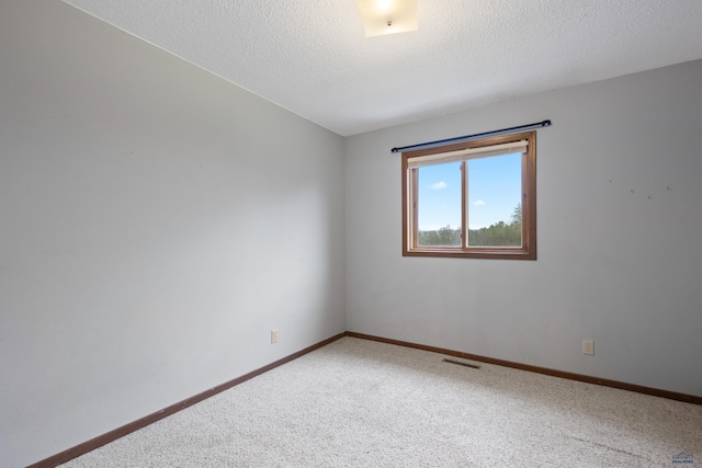 1705 Copperdale Dr, Rapid City, SD 57703 - empty room featuring light colored carpet, baseboards, and a textured ceiling
