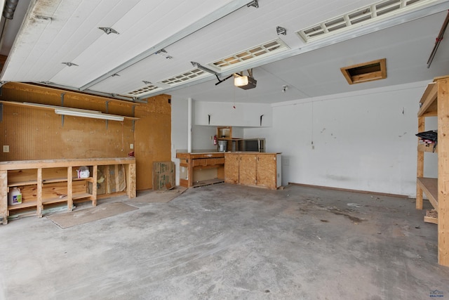 1705 Copperdale Dr, Rapid City, SD 57703 - garage featuring a workshop area and a garage door opener
