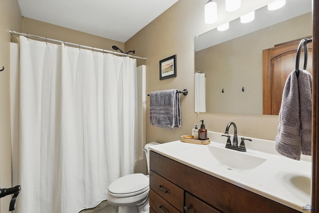 4528 Lahinch St, Rapid City, SD 57702 - full bathroom with toilet, vanity, and a shower with shower curtain