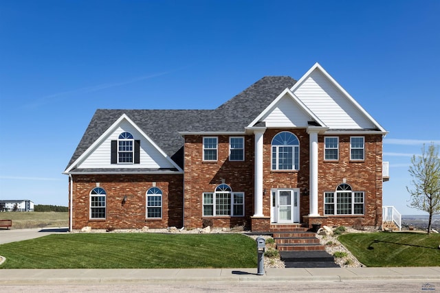 1120 S Regency Ct, Rapid City, SD 57702 - neoclassical / greek revival house with a front lawn and brick siding