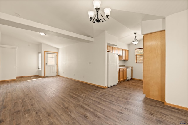 768 Earleen St Unit F, Rapid City, SD 57701 - unfurnished living room with vaulted ceiling, dark wood-style flooring, baseboards, and a chandelier