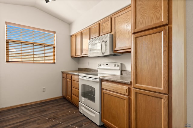 768 Earleen St Unit F, Rapid City, SD 57701 - kitchen with white appliances, dark wood-style flooring, lofted ceiling, and baseboards