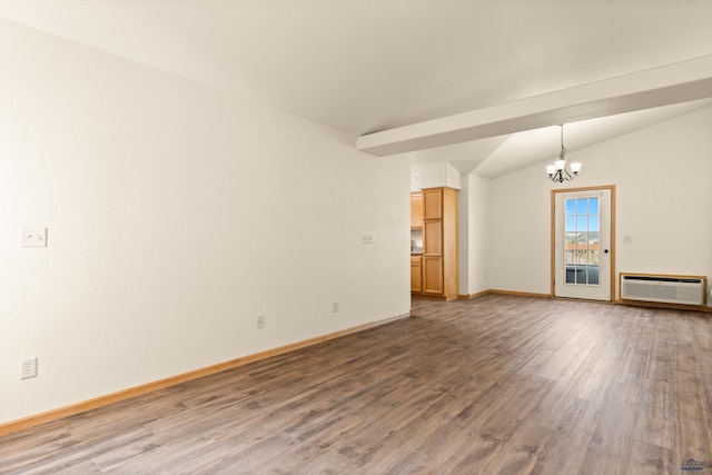 768 Earleen St Unit F, Rapid City, SD 57701 - unfurnished living room featuring a chandelier, wood finished floors, a wall unit AC, vaulted ceiling, and baseboards