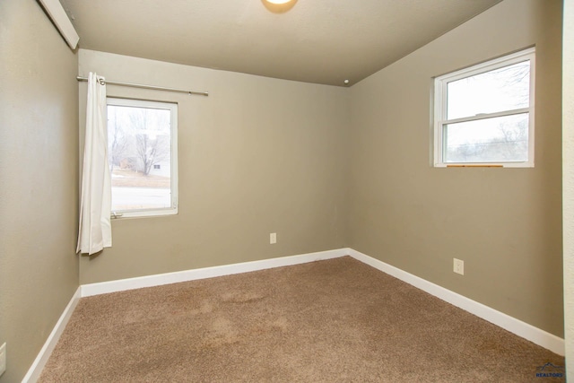 830 Willsie Ave, Rapid City, SD 57701 - spare room featuring healthy amount of natural light, carpet, and baseboards