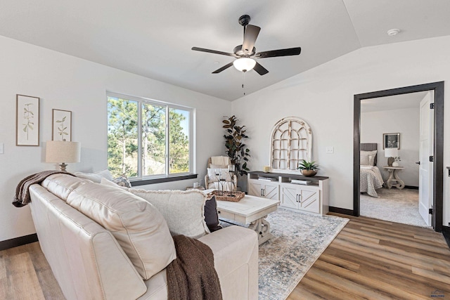 1246 Pinnacle Ct, Rapid City, SD 57701 - living area featuring a ceiling fan, wood finished floors, vaulted ceiling, and baseboards