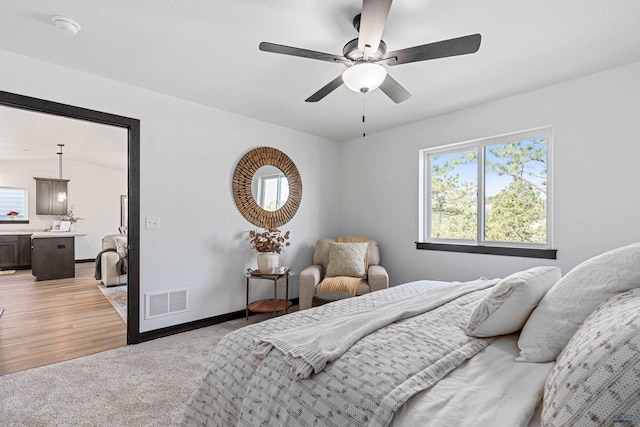 1246 Pinnacle Ct, Rapid City, SD 57701 - bedroom with light carpet, baseboards, and a ceiling fan