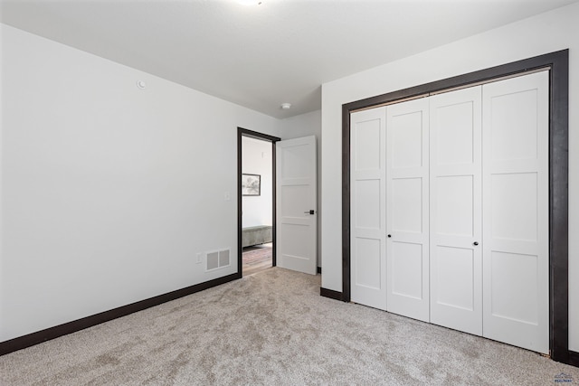 1246 Pinnacle Ct, Rapid City, SD 57701 - unfurnished bedroom featuring carpet, baseboards, and a closet