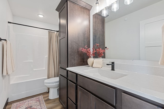 1246 Pinnacle Ct, Rapid City, SD 57701 - full bath featuring vanity, toilet, wood finished floors, and shower / tub combo with curtain