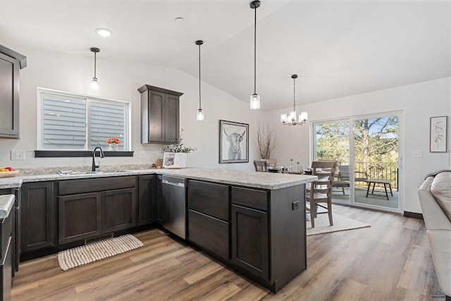 1246 Pinnacle Ct, Rapid City, SD 57701 - kitchen with stainless steel dishwasher, a peninsula, vaulted ceiling, a sink, and light wood-style flooring