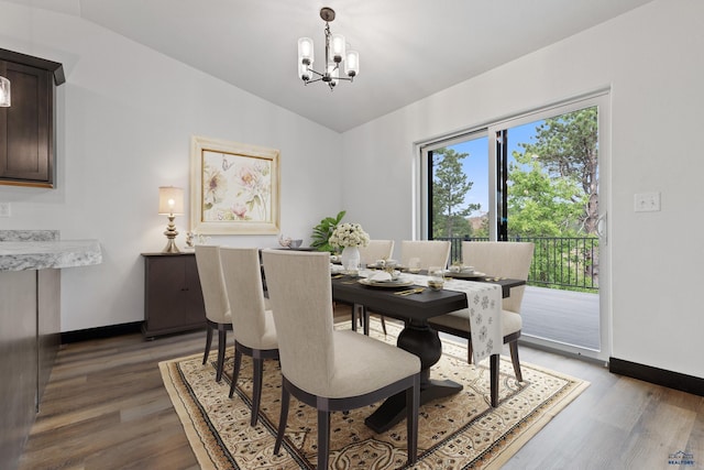 1246 Pinnacle Ct, Rapid City, SD 57701 - dining area featuring lofted ceiling, light wood-style flooring, a chandelier, and baseboards