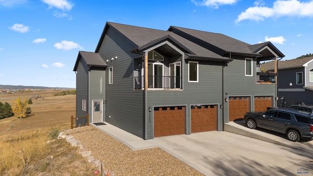 1740 Harmony Heights Ln, Rapid City, SD 57702 - view of property exterior with an attached garage, driveway, and roof with shingles