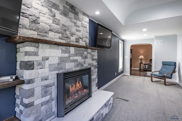 1316 Clark, Rapid City, SD 57701 - living area with arched walkways, a stone fireplace, carpet, recessed lighting, and baseboards