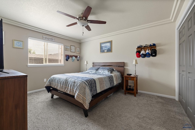 3511 Jerusalem Blvd, Rapid City, SD 57703 - bedroom featuring a closet, light colored carpet, ceiling fan, baseboards, and ornamental molding