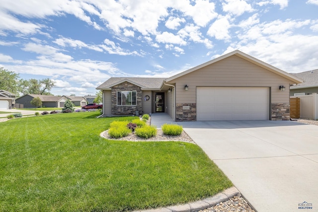3511 Jerusalem Blvd, Rapid City, SD 57703 - single story home with stone siding, concrete driveway, an attached garage, and a front lawn