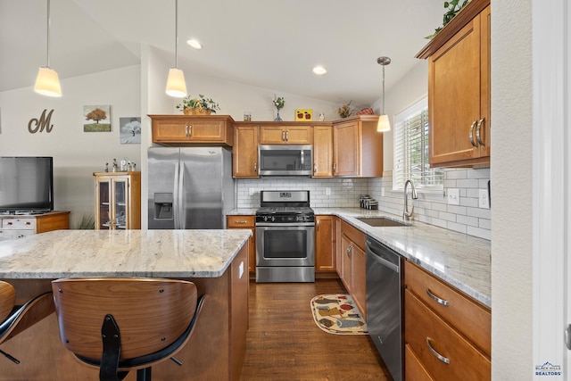 3511 Jerusalem Blvd, Rapid City, SD 57703 - kitchen featuring stainless steel appliances, vaulted ceiling, a sink, dark wood-type flooring, and decorative backsplash