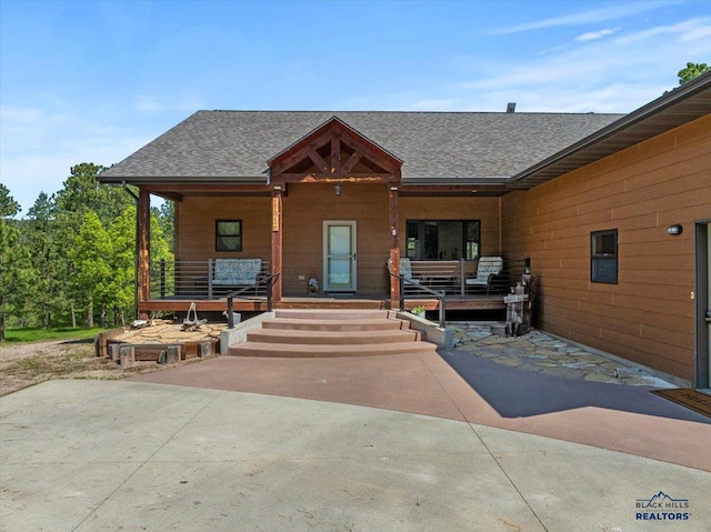 11916 Aspen View Rd, Sturgis, SD 57785 - view of front of house with a porch and a shingled roof