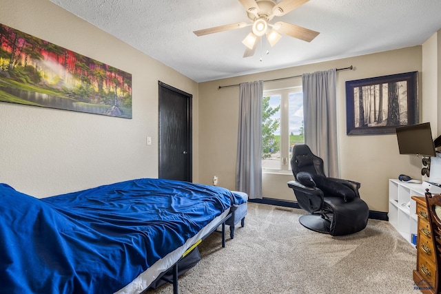 2909 Hoefer Ave, Rapid City, SD 57701 - bedroom with a textured ceiling, carpet flooring, and a ceiling fan