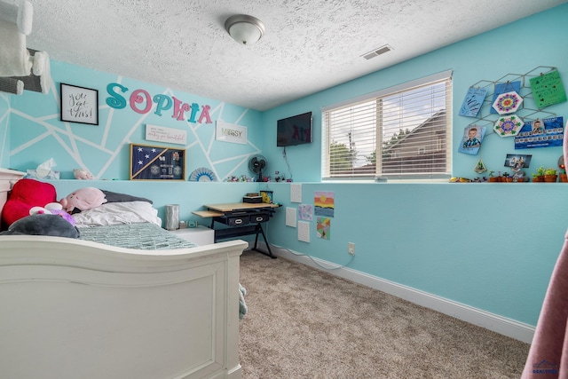 2909 Hoefer Ave, Rapid City, SD 57701 - carpeted bedroom with a textured ceiling and baseboards