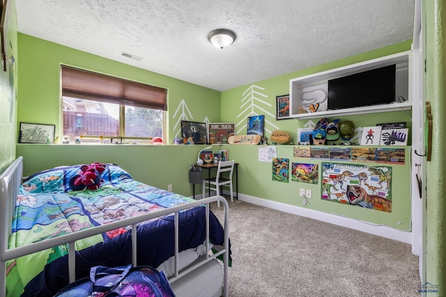 2909 Hoefer Ave, Rapid City, SD 57701 - carpeted bedroom with a textured ceiling and baseboards