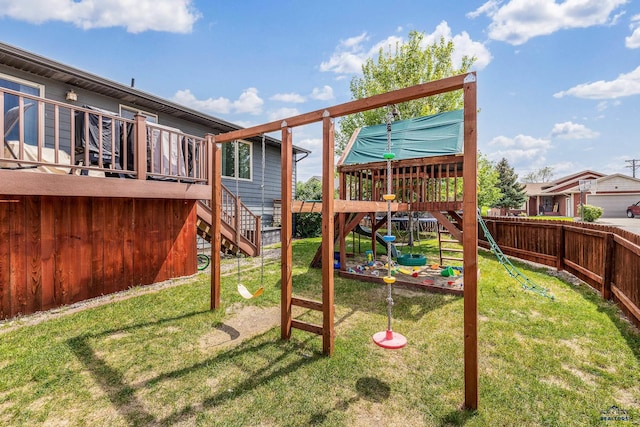 2909 Hoefer Ave, Rapid City, SD 57701 - fenced backyard with a playground and stairs