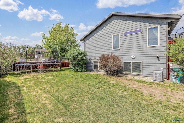 2909 Hoefer Ave, Rapid City, SD 57701 - back of house with a trampoline and a yard