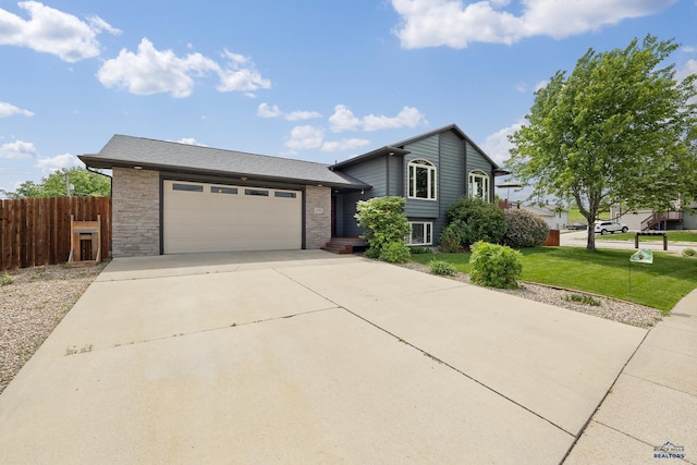 2909 Hoefer Ave, Rapid City, SD 57701 - split level home with driveway and an attached garage